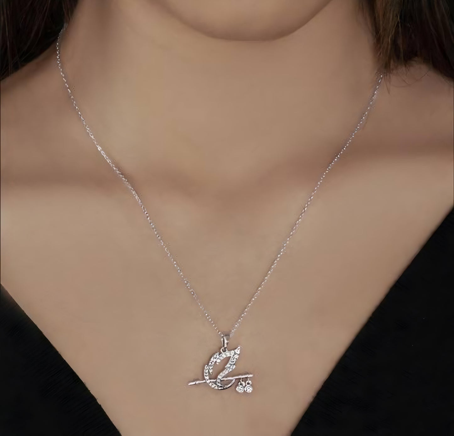 Sterling Silver Flute Pendant Necklace with Peacock Feather Design