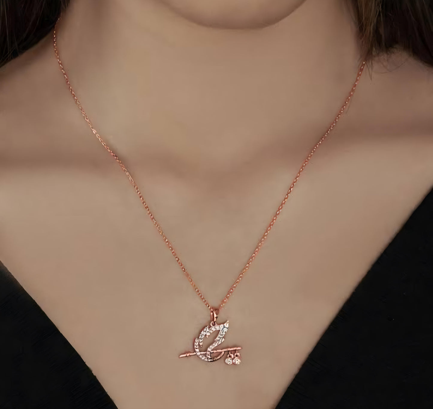 Rose Gold Flute Pendant Necklace with Peacock Feather Design